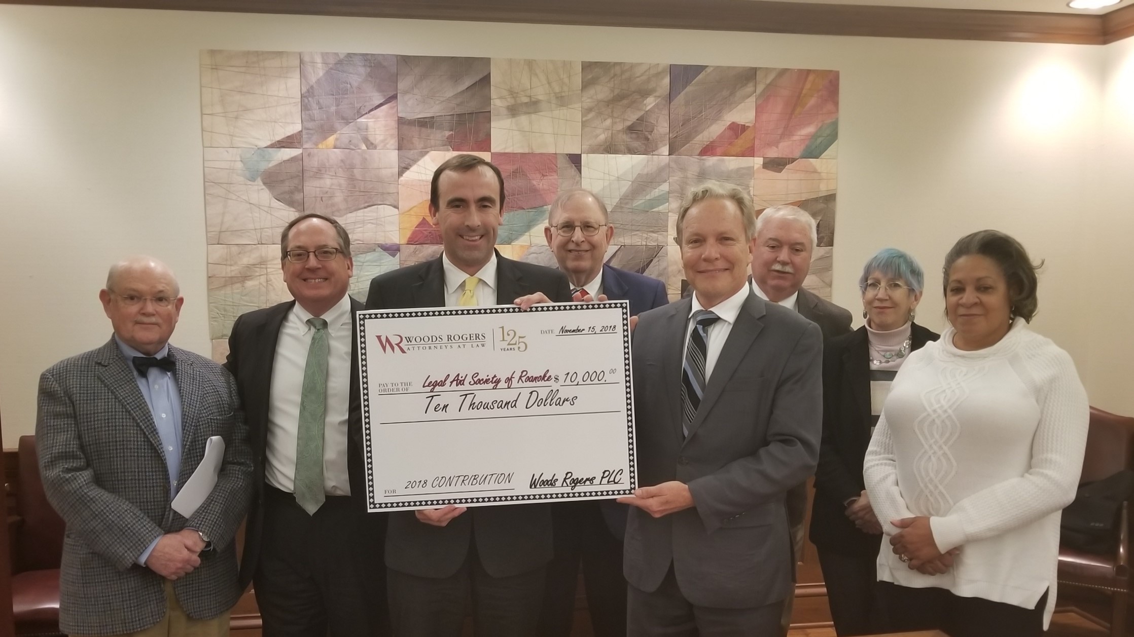 Woods Rogers President Dan Summerlin presents David Beidler and the Board of Directors of the Legal Aid Society of Roanoke Valley with a $10,000 contribution.